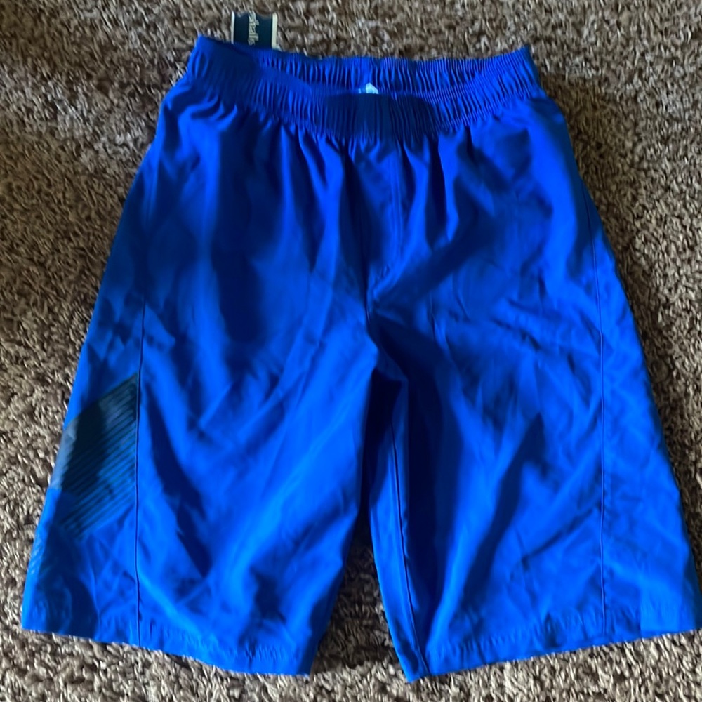 NWT youth XL Under Armour swim trunks.